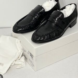 The row soft loafers black eel